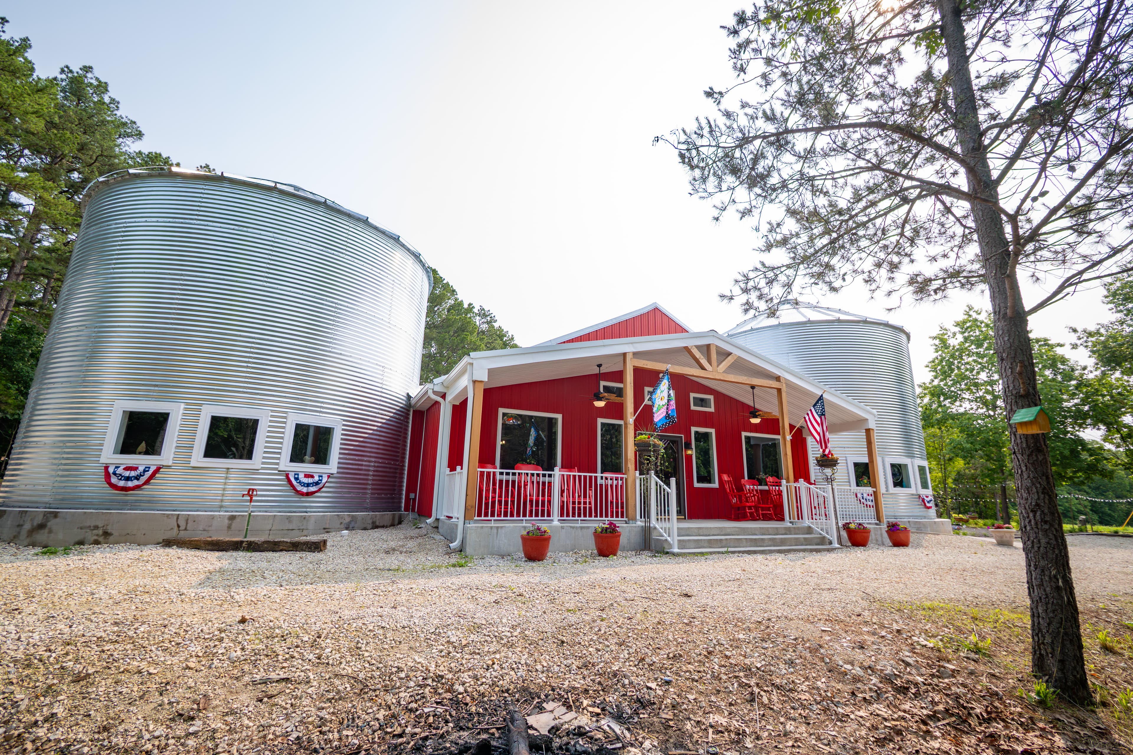 2 guest grain bins attached to large red barn where common area known as "The Roost" is located