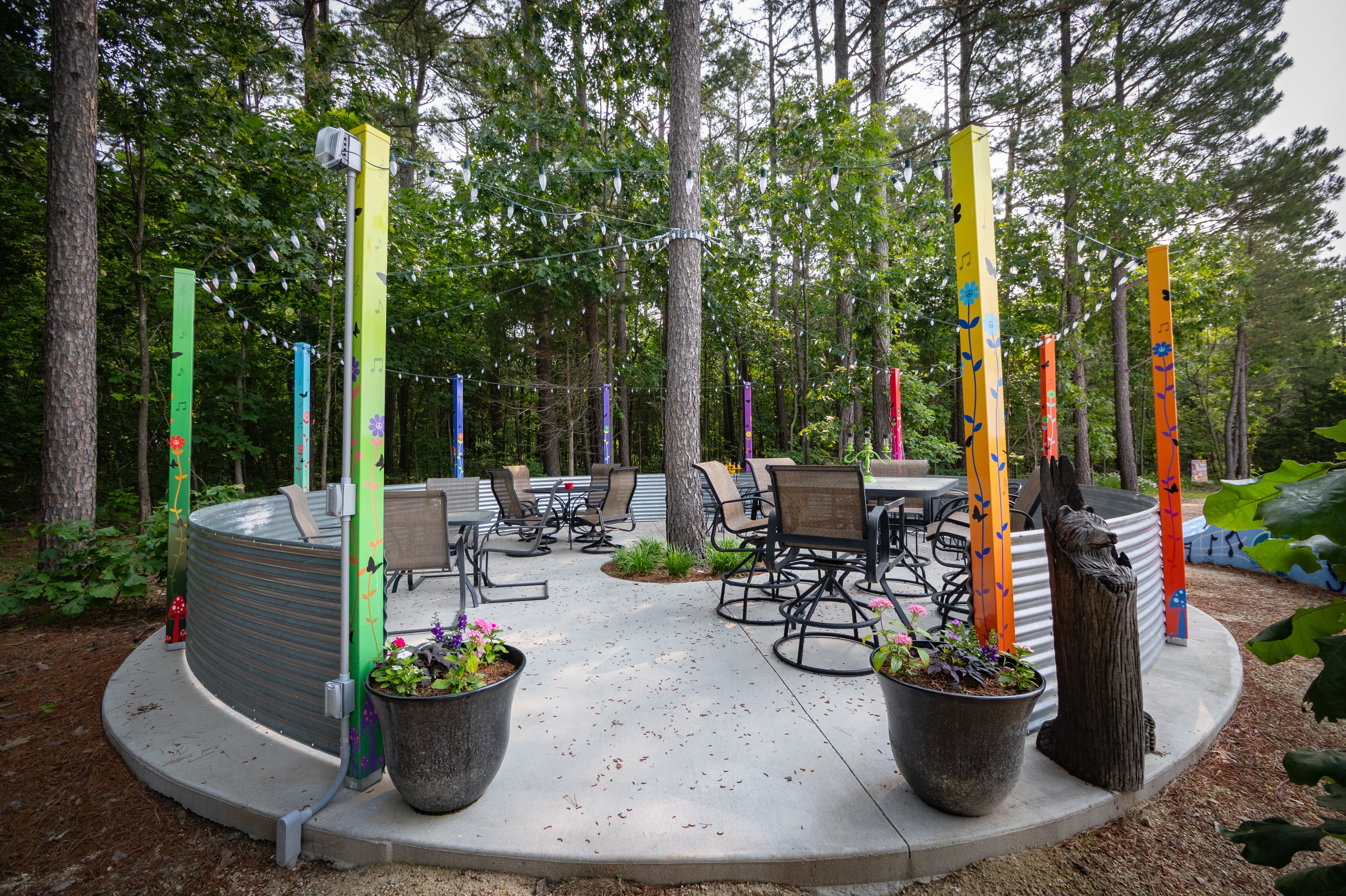 Pine tree patio in 45 foot pine tree woods with overhead lighting