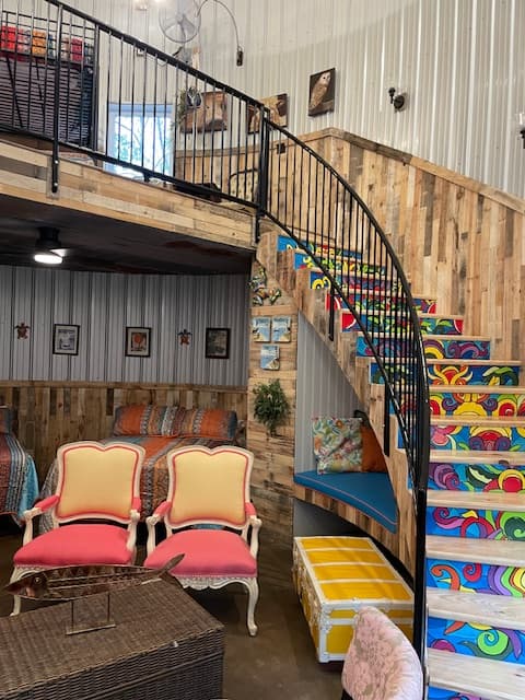 Two levels with artist hand painted staircase that leads to balcony